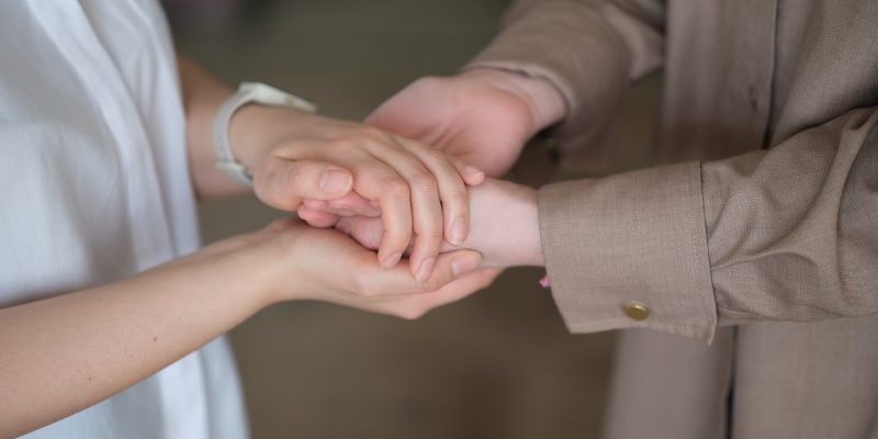 psychologists holding the client's hands, emotional support and mental health services, medical and
